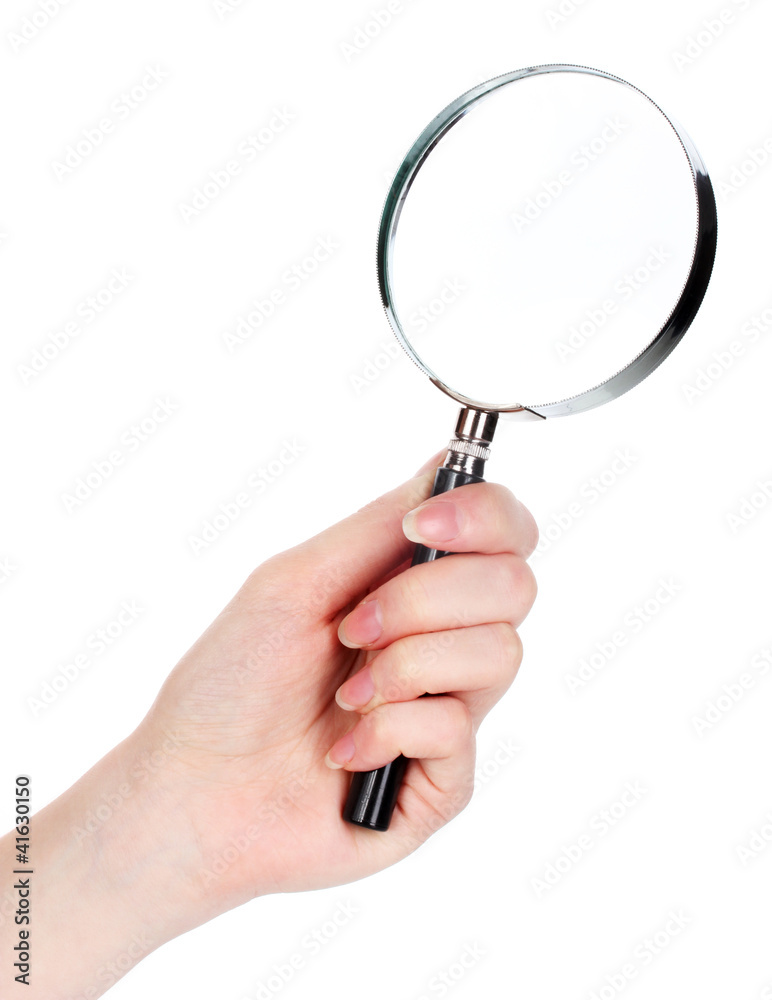 Magnifying glass in hand isolated on white Magnifying glass in hand isolated on white
