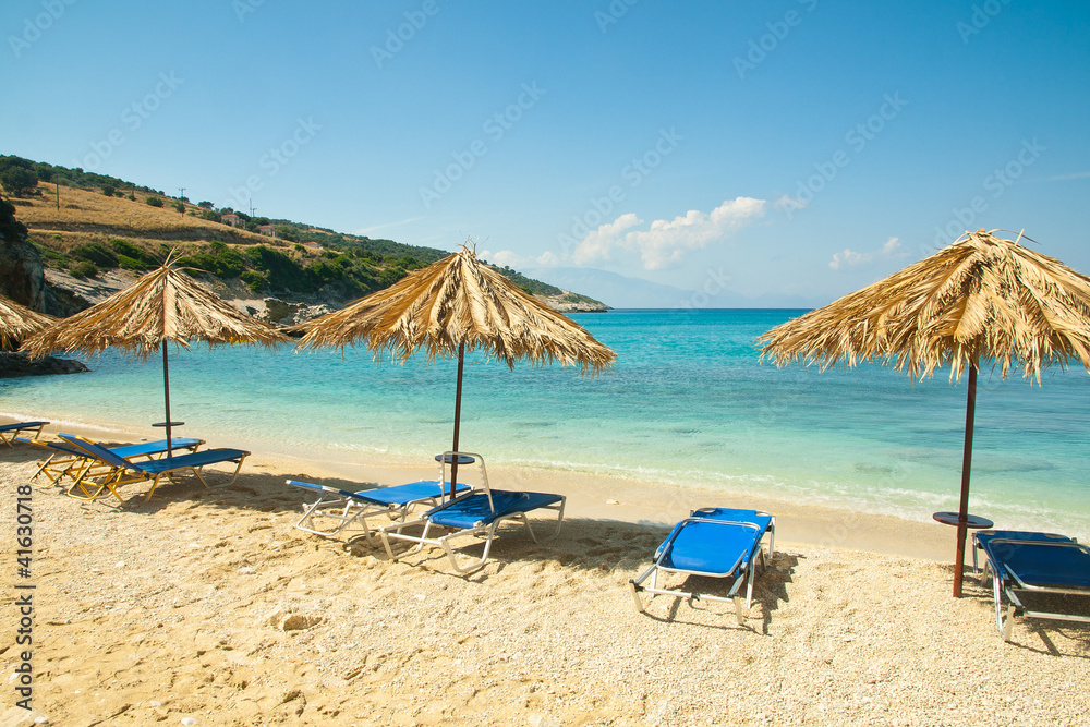 Beautiful beach view with sunbeds and umbrellas at Xigia beach.