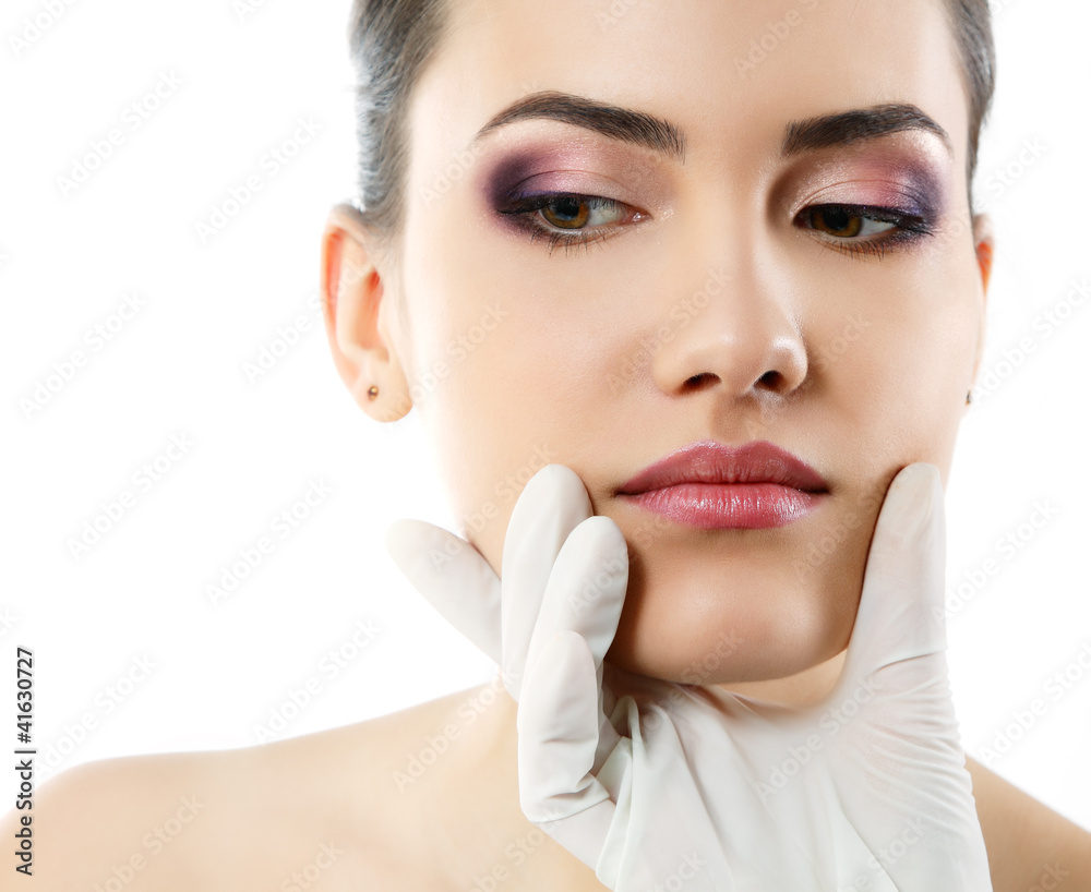 beautiful young female face with beauty treatment