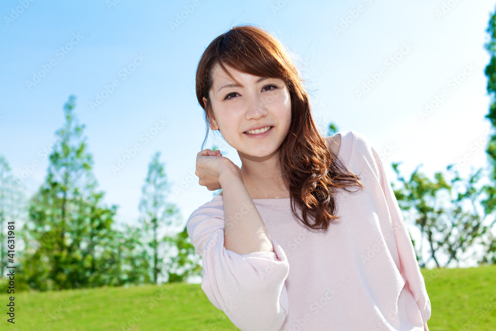 Beautiful young woman outdoors over blue sky. Portrait of asian Beautiful young woman outdoors over blue sky. Portrait of asian