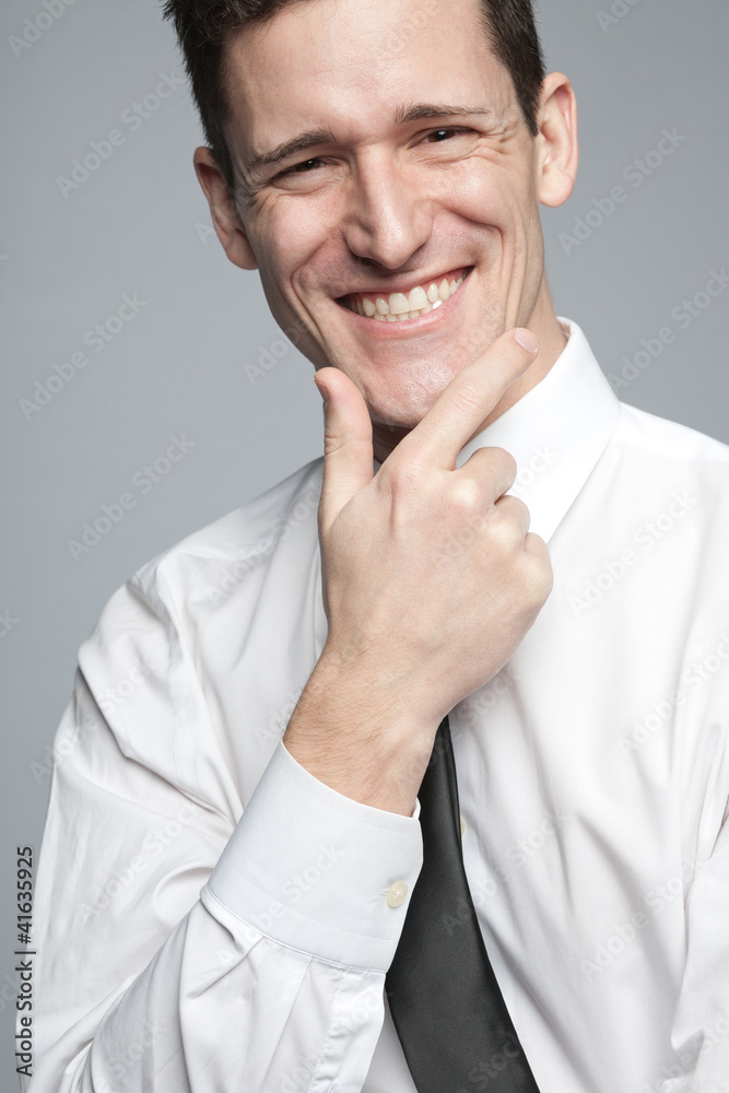 Businessman in white shirt expressing positivity. Businessman in white shirt expressing positivity.