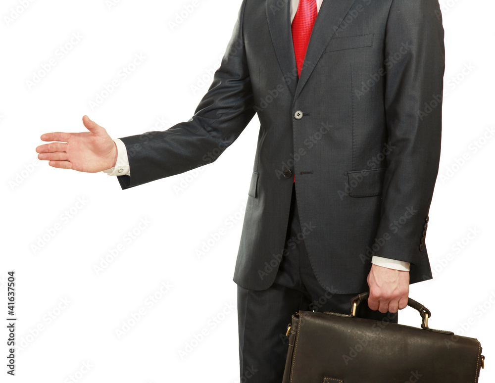 Portrait of a businessman giving a hand, focus on his hand Portrait of a businessman giving a hand, focus on his hand