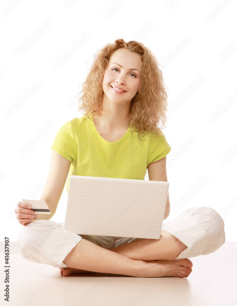 Happy woman sitting on floor and shopping online Happy woman sitting on floor and shopping online