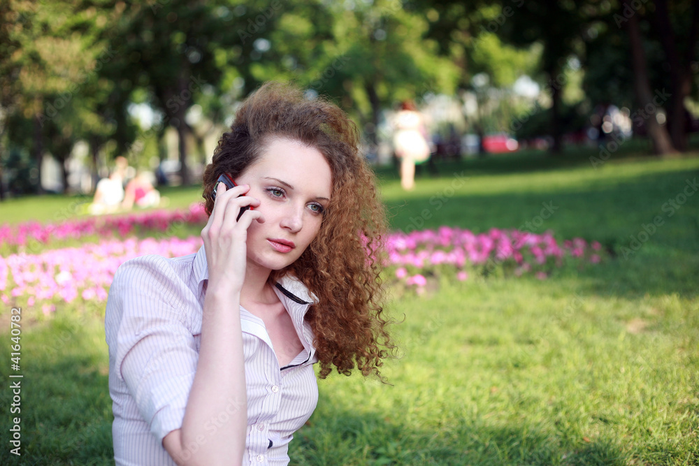 cute curly girl talking on the phone cute curly girl talking on the phone