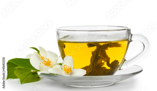 cup of green tea with jasmine flowers isolated on white