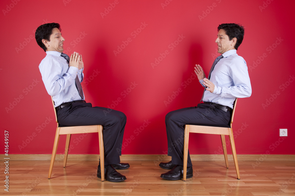 Twin businessman confrontation Twin businessman confrontation