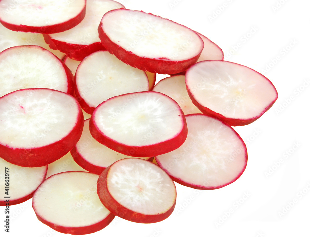 slices of red radish arranged on white background