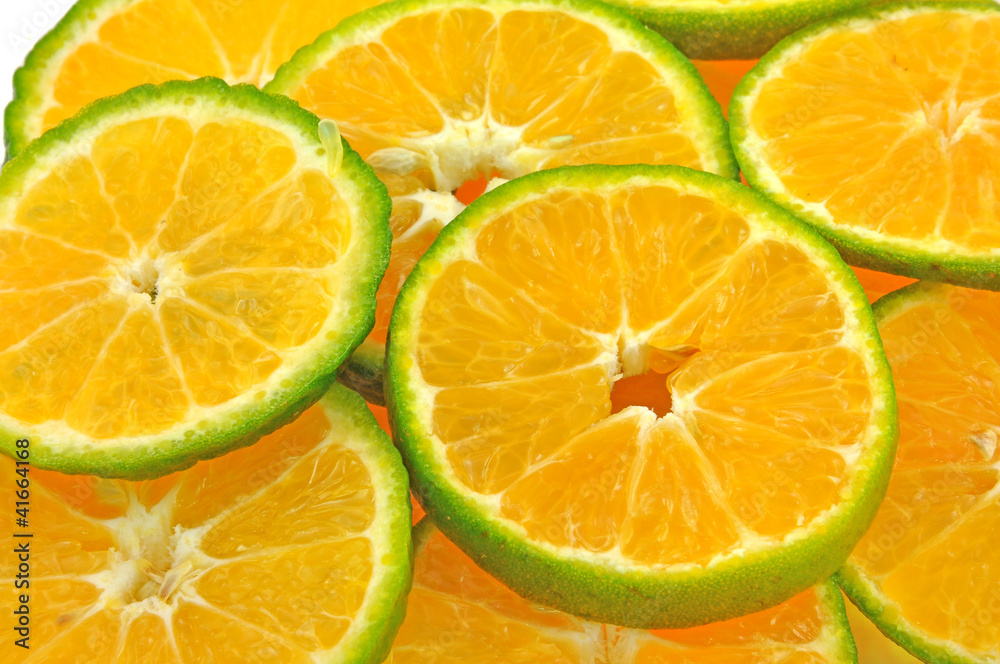 Fototapeta premium fresh slices of orange piled on white