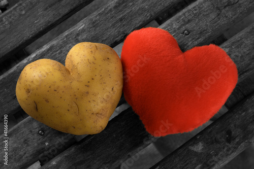 Perfect potato heart with a red heart symbol photo