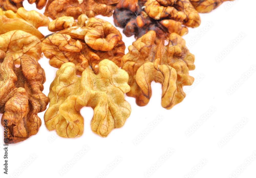 close up of edible portion of walnut arranged on white close up of edible portion of walnut arranged on white