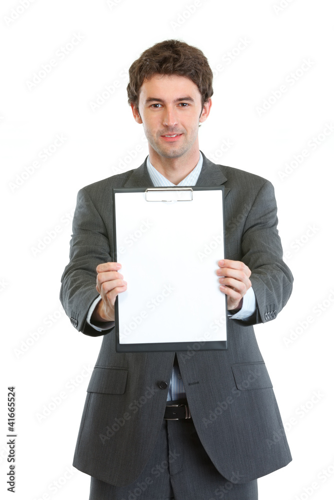Modern businessman showing blank clipboard Modern businessman showing blank clipboard