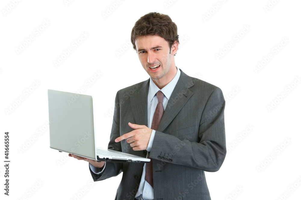 Angry businessman pointing in laptop Angry businessman pointing in laptop