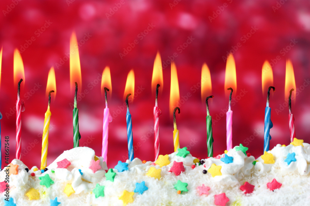 beautiful birthday candles  on red background