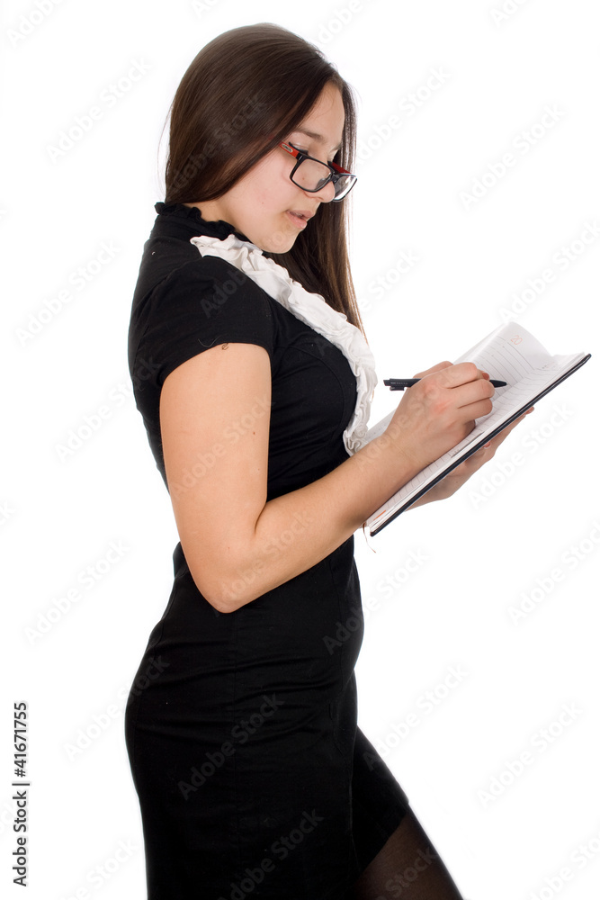 Thoughtful young girl holding pen and notepad, isolated on white Thoughtful young girl holding pen and notepad, isolated on white
