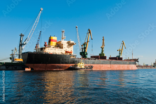 Big ship unloading in shipyard