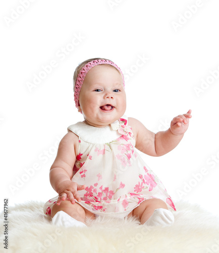 cute baby girl sitting and ...