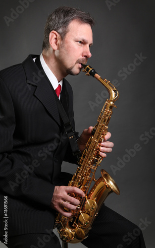 saxophonist on dark