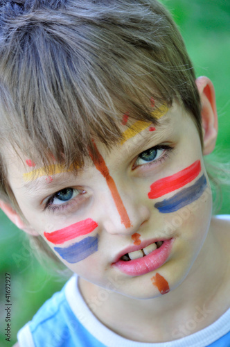 football fan child with painting on his face