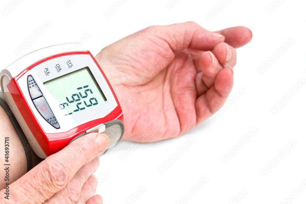 Old woman's hands measuring blood pressure Old woman's hands measuring blood pressure