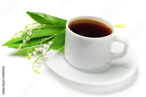 Cup of tea and lilies of the valley