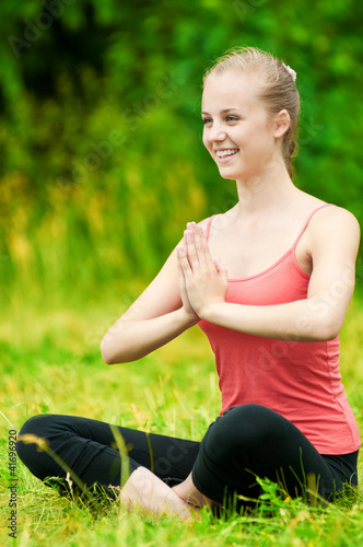 Young woman doing stretching exercise © mr.markin