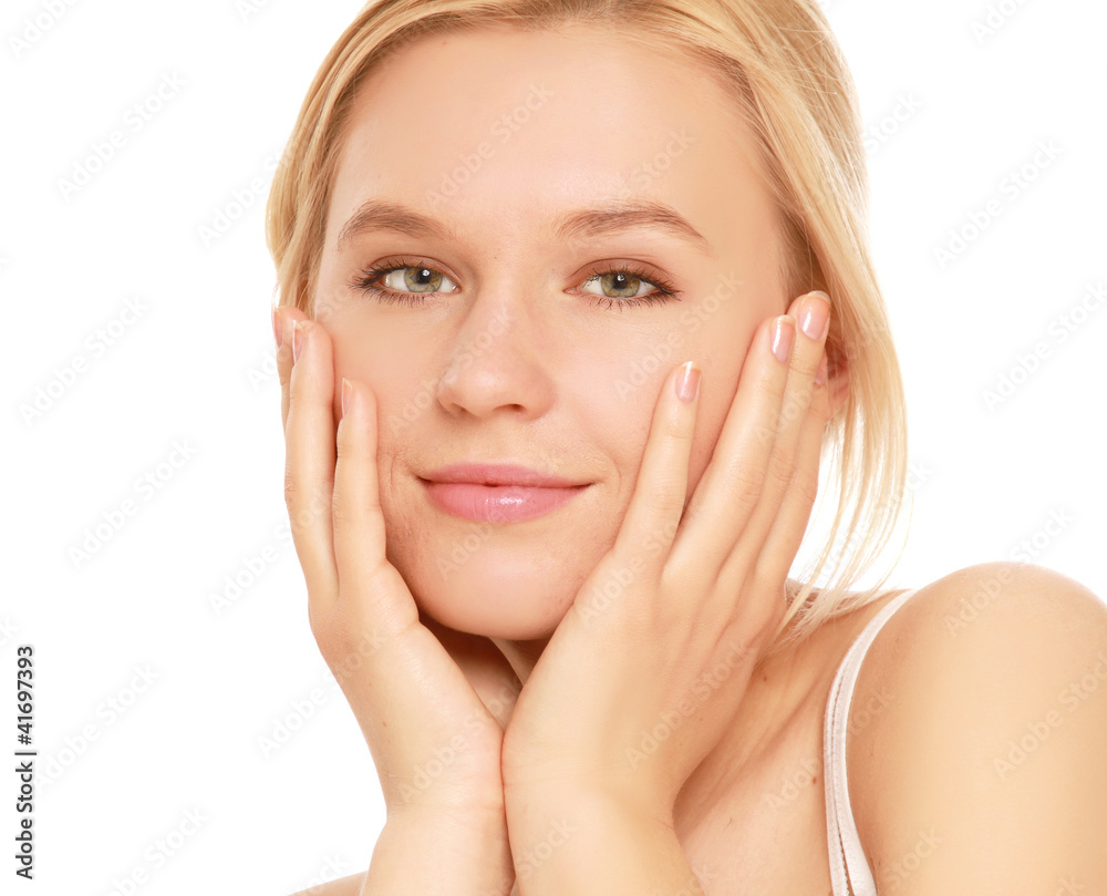 A young woman touching her face , isolated on white background