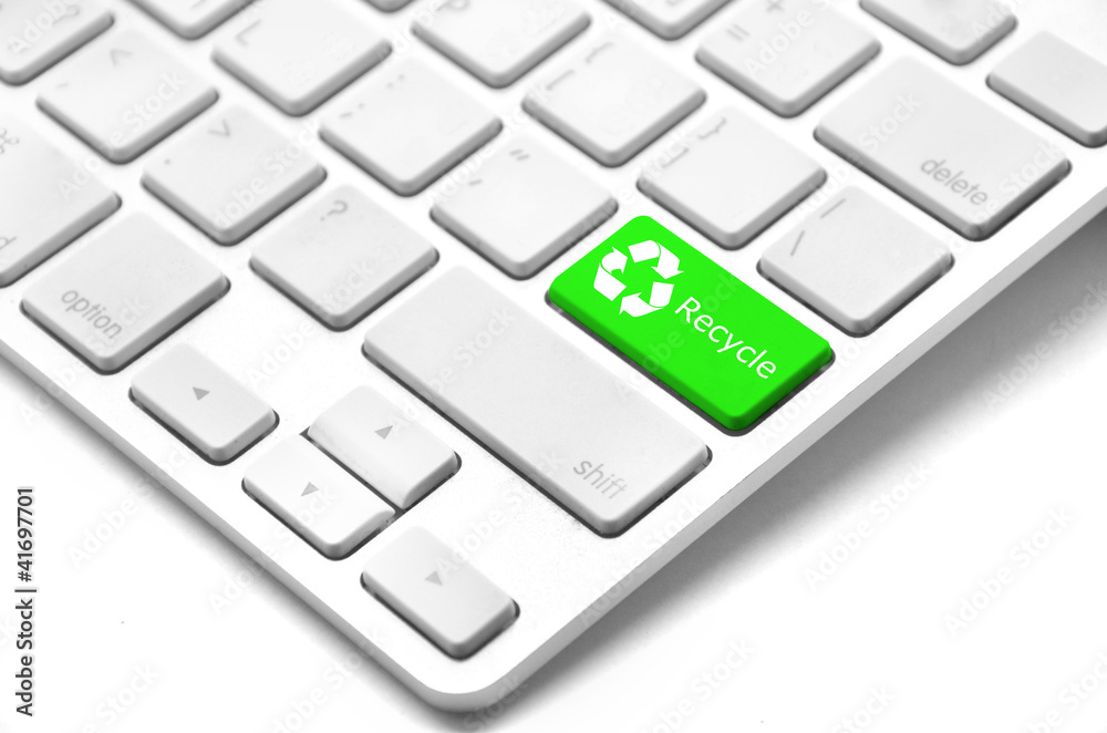 Closeup of computer keyboard key in green color with three-arrow Closeup of computer keyboard key in green color with three-arrow