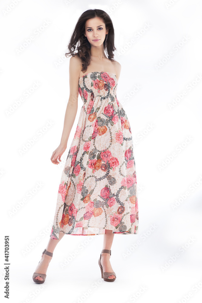 Young pretty woman in elegant light fashion dress, studio shot Young pretty woman in elegant light fashion dress, studio shot
