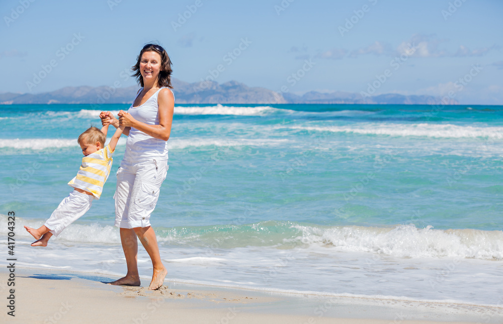 Mother and son having fun on beach Mother and son having fun on beach