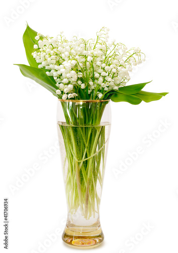 bouquet of lilies of the valley in glass vase