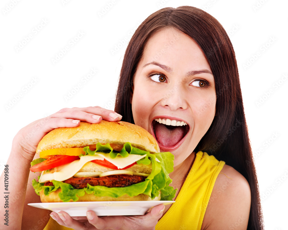 Woman holding hamburger.