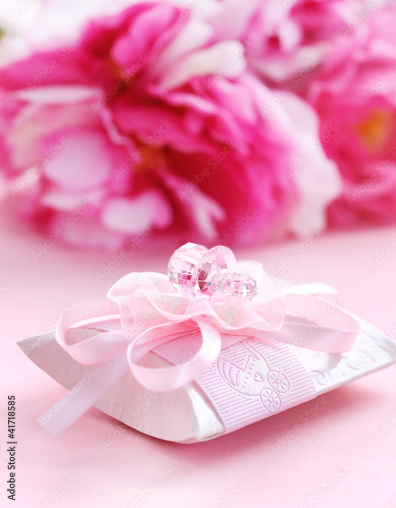 Pink present box with pacifier Pink present box with pacifier