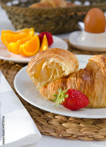 Breakfast setting with french croissants