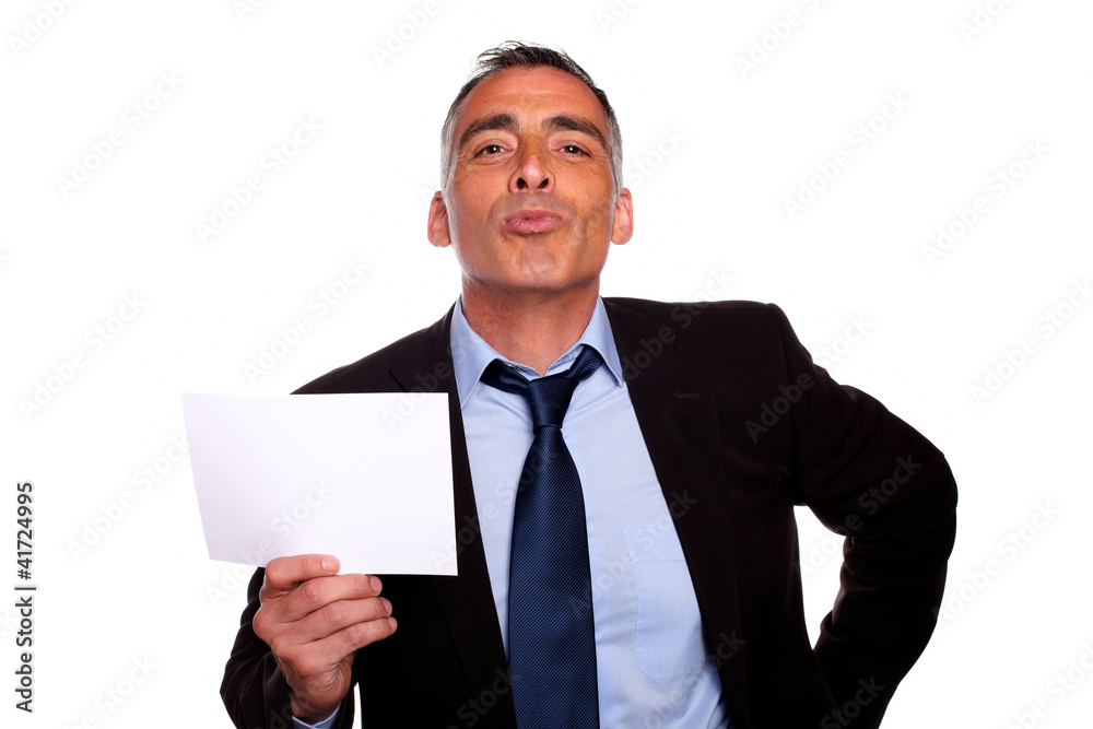 Friendly senior businessman showing a while card Friendly senior businessman showing a while card