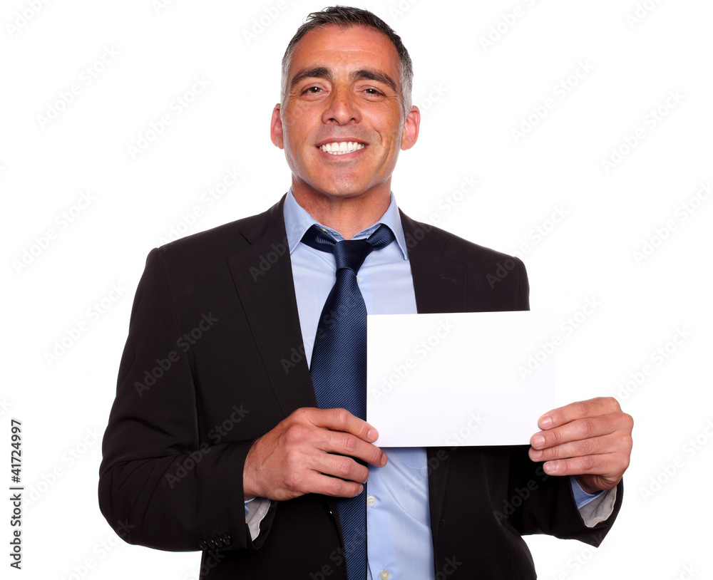 Attractive man smiling and showing a while card Attractive man smiling and showing a while card