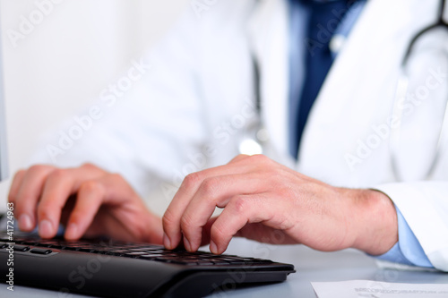 Doctor hands using a computer