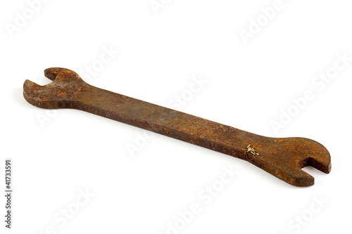 Rusty spanner over white