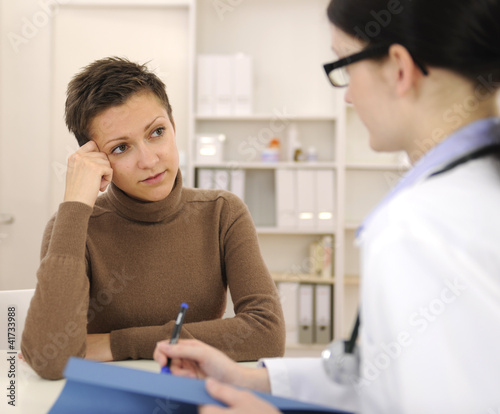 Psychologist and depressed patient at office