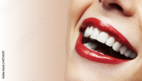 Woman smiling with great teeth on white background