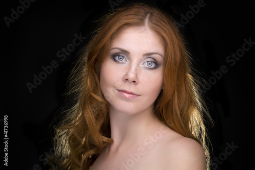 Closeup portrait of a redhead female model