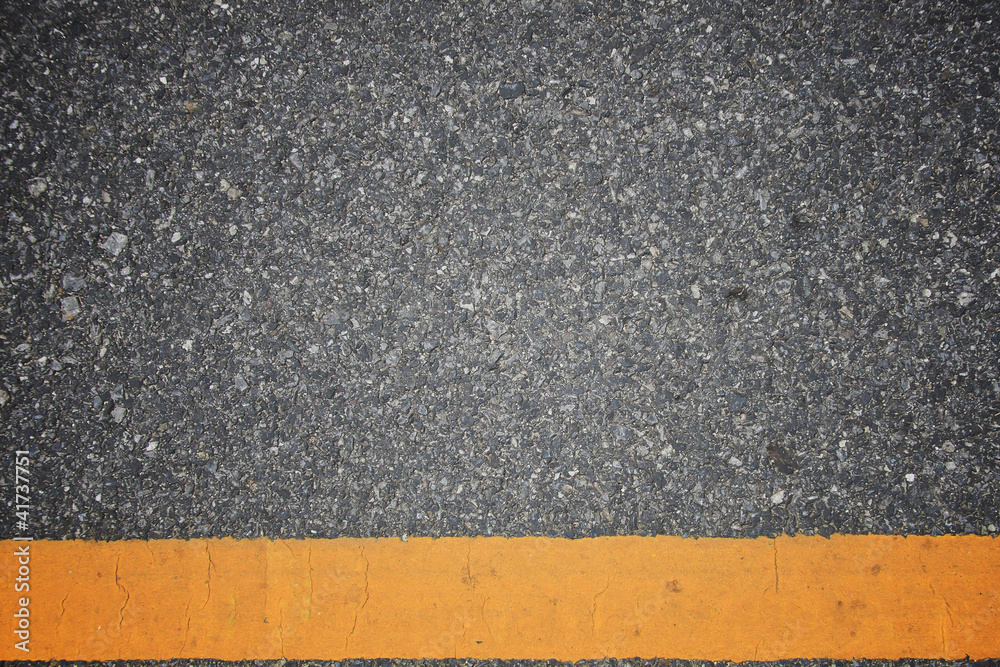 Fototapeta premium Asphalt road texture with yellow stripe