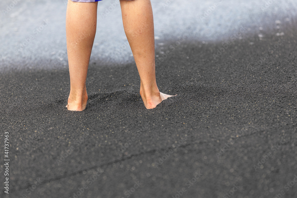 feet of boy at the beach
