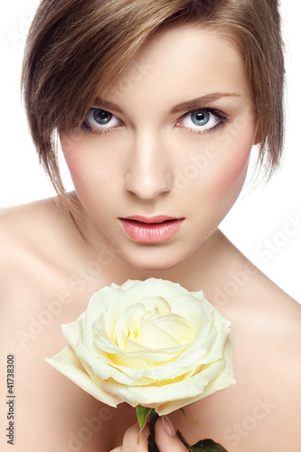 young beautiful girl with perfect skin  and a rose