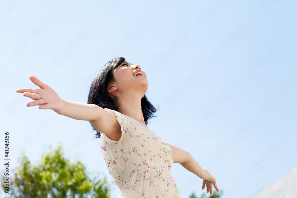 Beautiful young woman outdoors over blue sky Beautiful young woman outdoors over blue sky