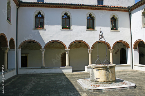 cloister of the convent with the ancient well