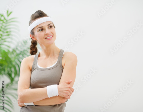 Portrait of fitness woman looking on copy space