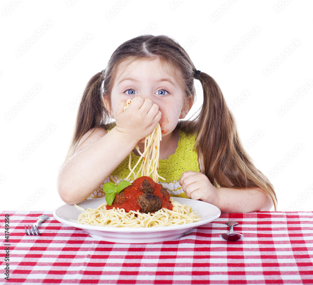 Beautiful girl eating pasta and meatballs with hands Beautiful girl eating pasta and meatballs with hands