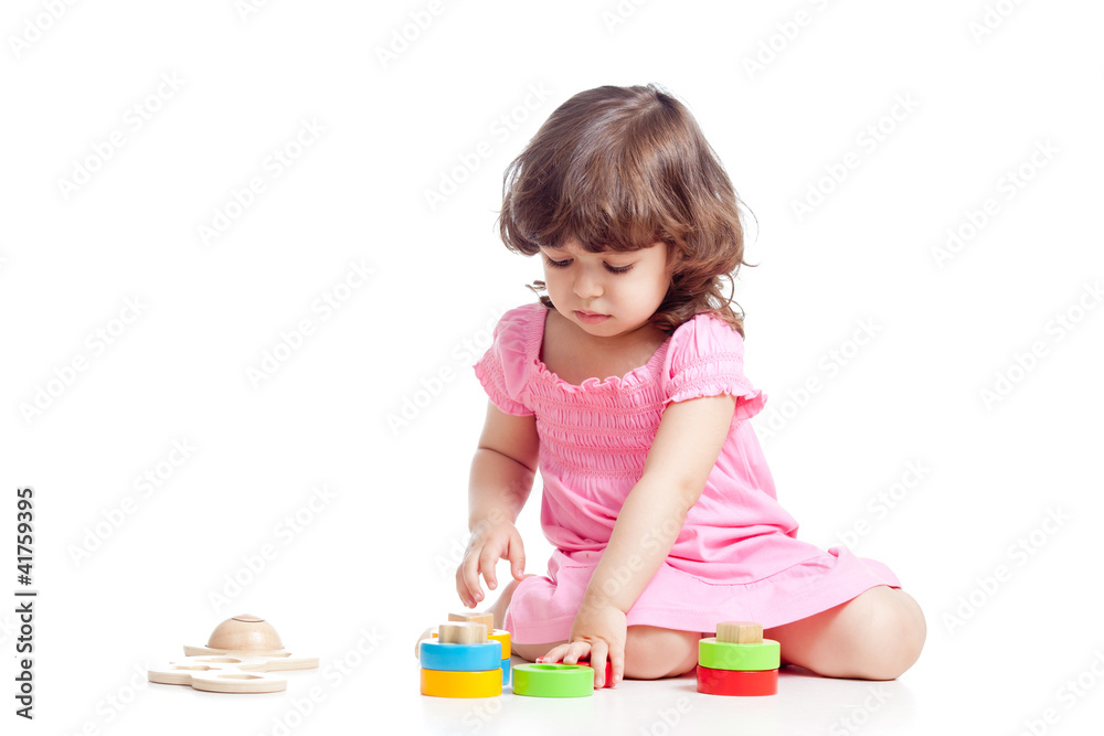 little child playing with colorful toys, isolated over white