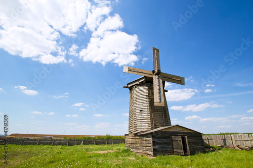 old wooden windmill in russian village