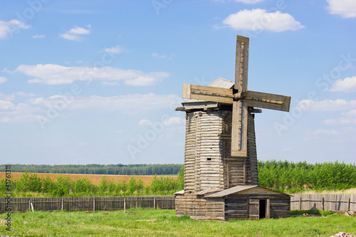 old wooden windmill in russian village